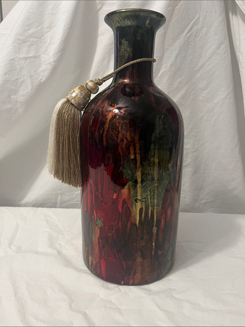 Ceramic Accent Vase in Burgundy, Gold and Green with tassel.